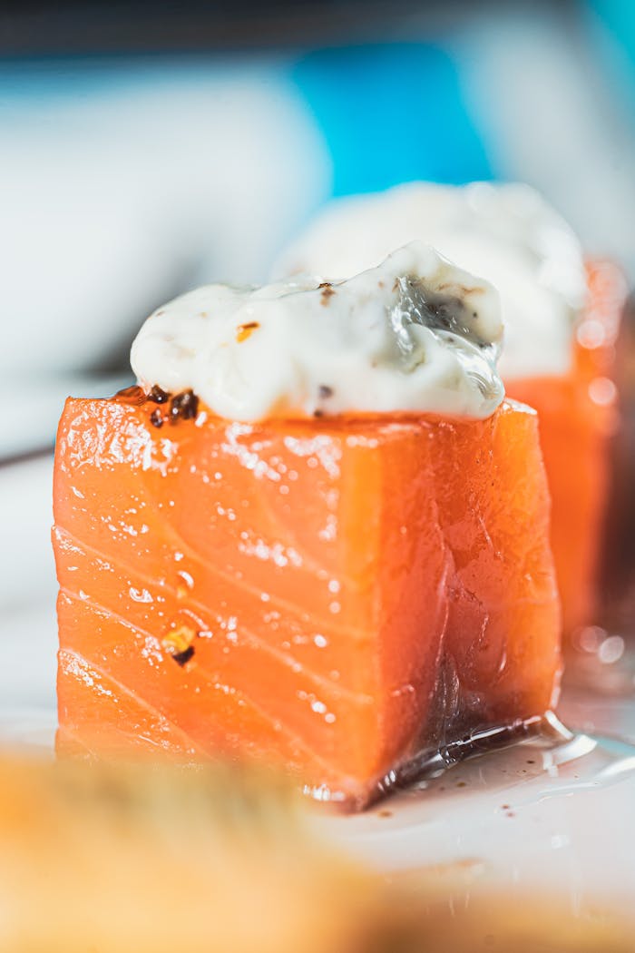 Delicious fresh salmon topped with creamy sauce, perfect for gourmet dining.